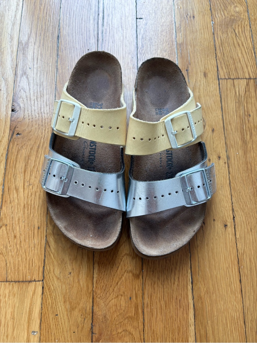 Birkenstock Arizona Two-Band Sandals in Metallic Silver and Cream